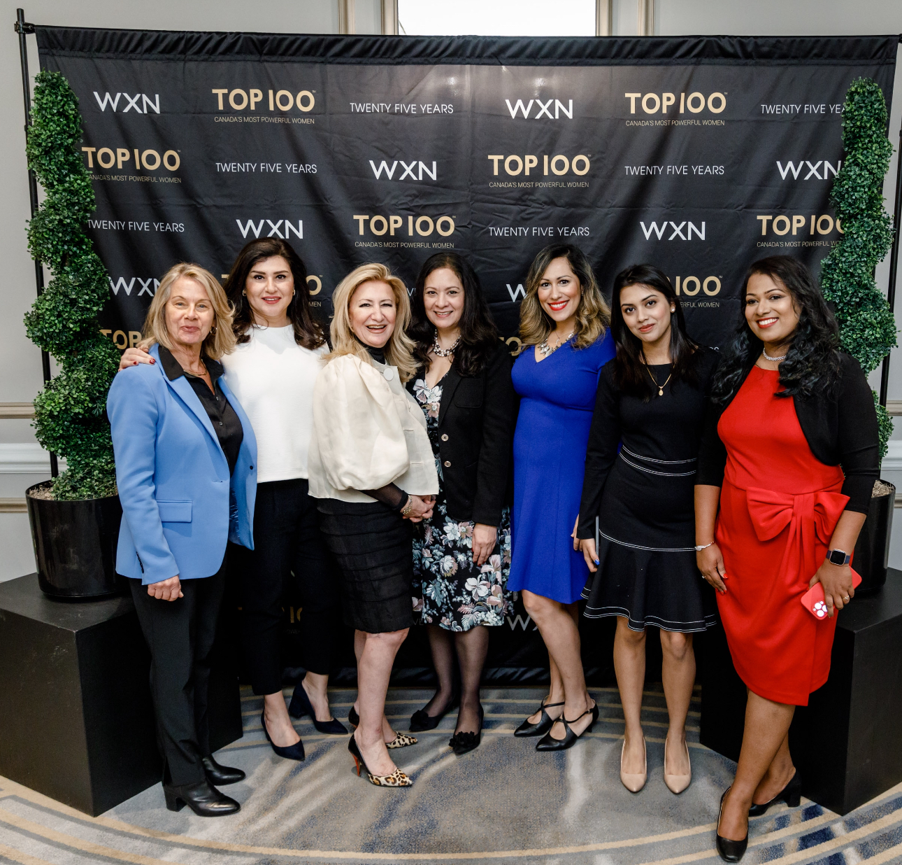 Alisha speaking on stage